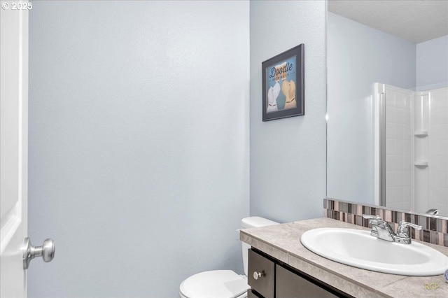 51568 SW S Fork Loop, Scappoose, OR 97056 - full bathroom with vanity, toilet, and a shower