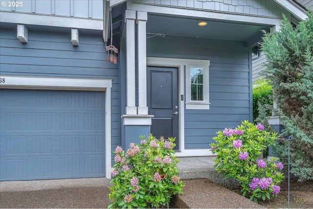 51568 SW S Fork Loop, Scappoose, OR 97056 - view of exterior entry with an attached garage