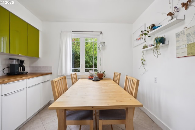 dining space featuring light tile patterned floors