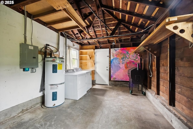 below grade area with washing machine and clothes dryer, electric panel, secured water heater, and a garage