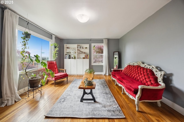 living area with hardwood / wood-style flooring