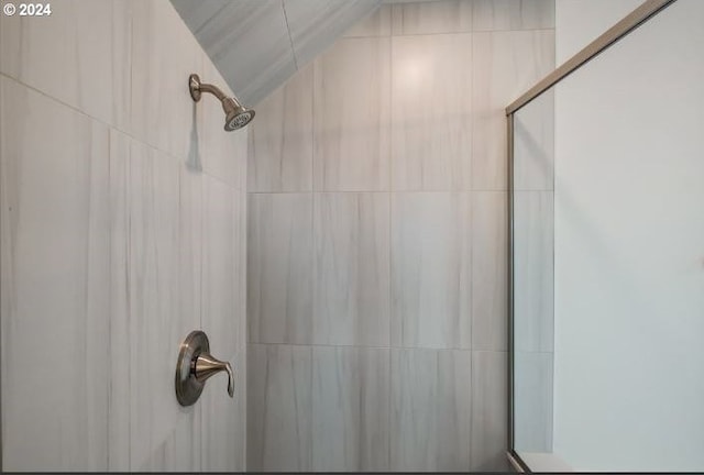 bathroom with a tile shower