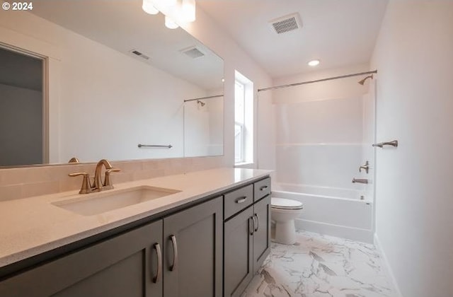 full bathroom featuring visible vents, marble finish floor, toilet, vanity, and shower / bathtub combination
