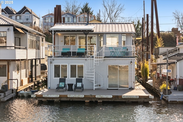 rear view of house with a water view