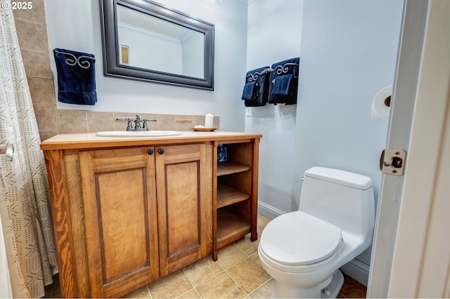 bathroom featuring vanity, tile patterned flooring, and toilet