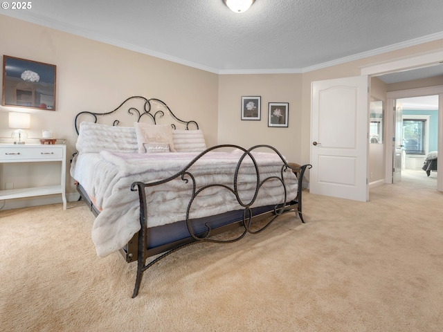 carpeted bedroom featuring a textured ceiling and crown molding