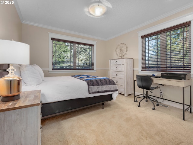 bedroom with light colored carpet, multiple windows, and crown molding