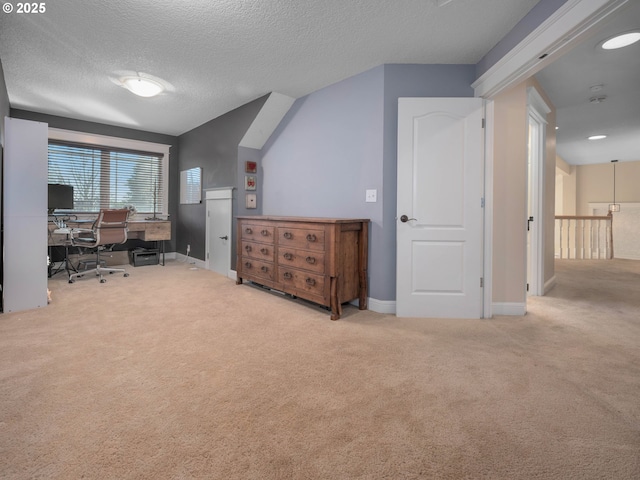 office area featuring carpet flooring and a textured ceiling