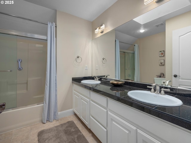 bathroom featuring vanity,  shower combination, a skylight, and tile patterned floors