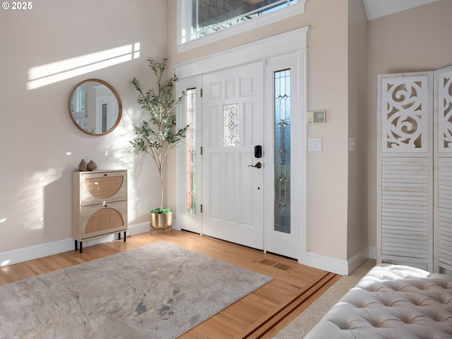 entryway featuring light hardwood / wood-style floors and a wealth of natural light