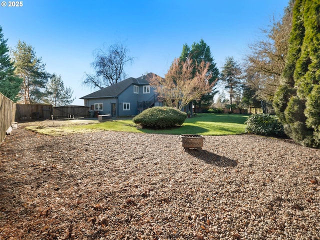 view of yard with a fire pit