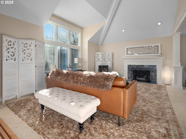 living room with light carpet, high vaulted ceiling, a fireplace, beamed ceiling, and decorative columns