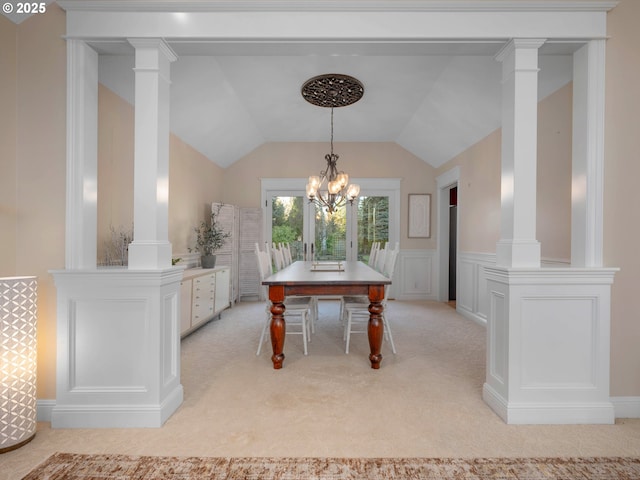 dining room featuring light colored carpet, lofted ceiling, and a notable chandelier