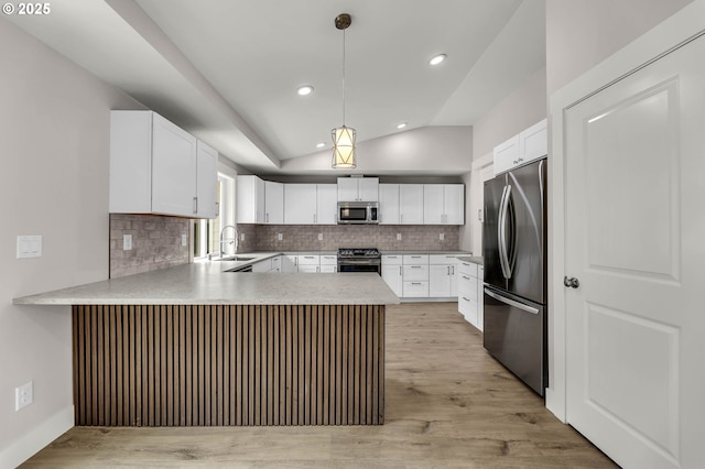 1633 N Q St, Washougal, WA 98671 - kitchen with appliances with stainless steel finishes, a peninsula, backsplash, recessed lighting, and light countertops