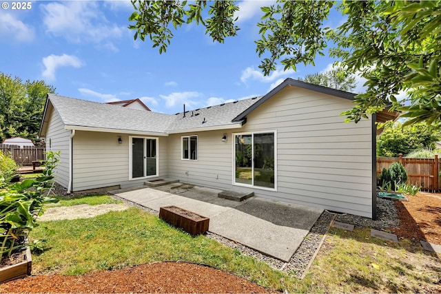 1633 N Q St, Washougal, WA 98671 - rear view of property featuring roof with shingles and a patio