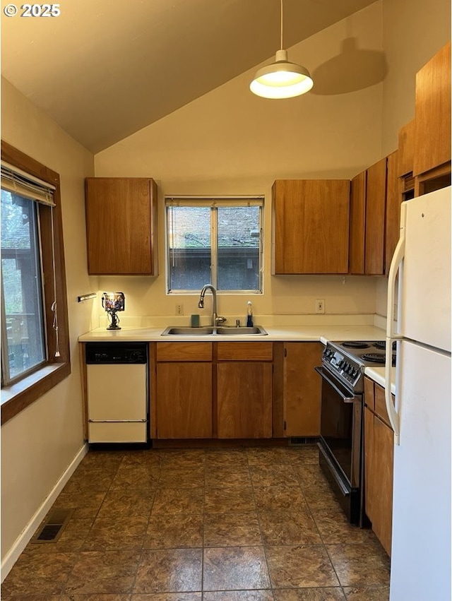 kitchen with white appliances, sink, pendant lighting, a healthy amount of sunlight, and lofted ceiling