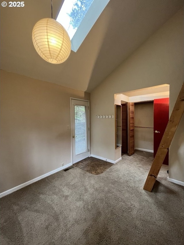 interior space featuring high vaulted ceiling and carpet floors