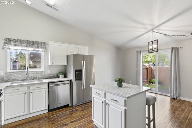 516 SE 8th Pl Unit H17, Battle Ground, WA 98604 - kitchen with a sink, vaulted ceiling, stainless steel appliances, and dark wood-style floors