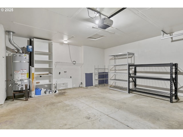 garage featuring secured water heater and a garage door opener