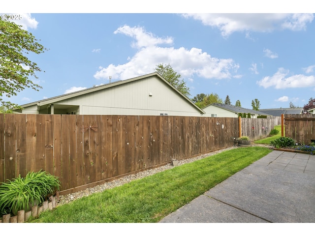 view of yard with a patio and fence