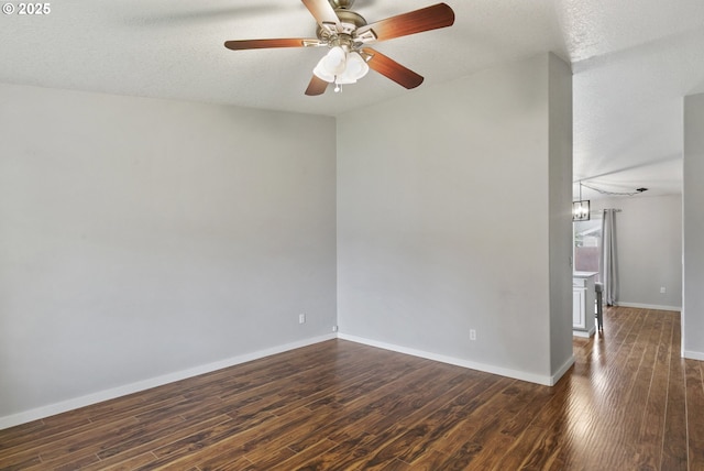516 SE 8th Pl Unit H17, Battle Ground, WA 98604 - unfurnished room featuring baseboards, a ceiling fan, and dark wood-style flooring