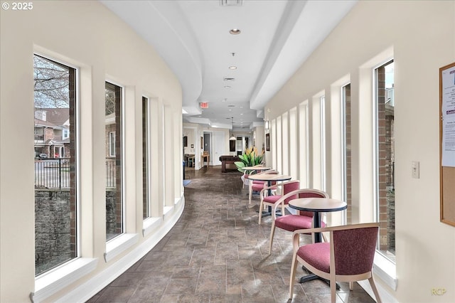 hall with recessed lighting and stone finish floor