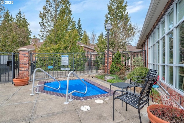 view of pool with a patio, a pool, and fence