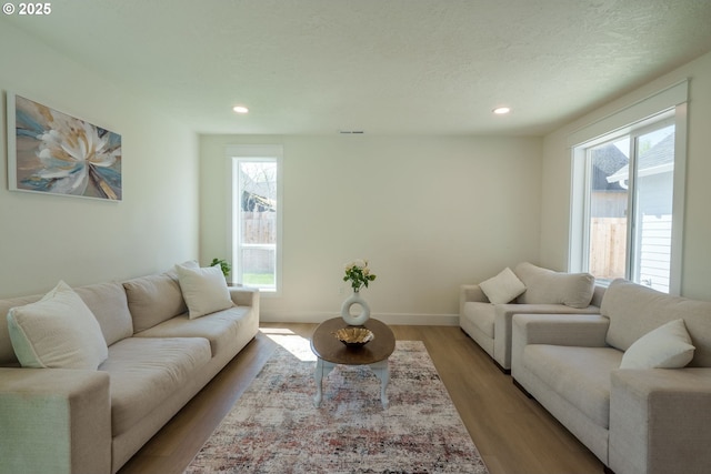 535 E St, Independence, OR 97351 - living room featuring healthy amount of natural light, recessed lighting, and light wood-type flooring