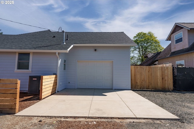 535 E St, Independence, OR 97351 - view of side of home with a shingled roof, driveway, and an attached garage