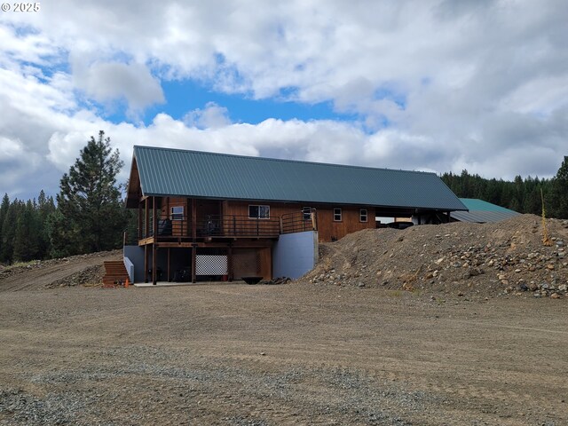 view of property exterior with metal roof