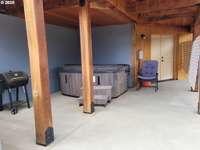 view of patio / terrace with a hot tub and area for grilling