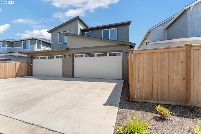8229 SE Kinnaman St, Hillsboro, OR 97123 - view of front of house featuring concrete driveway and an attached garage