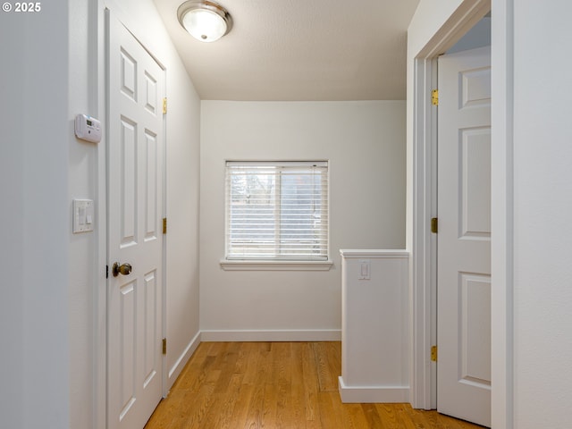 corridor featuring light hardwood / wood-style floors