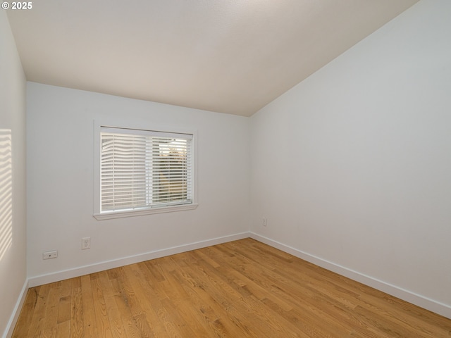 spare room featuring light wood-type flooring