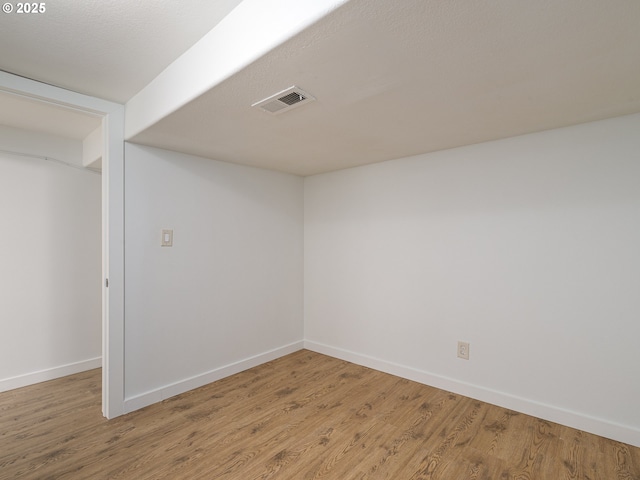 basement featuring hardwood / wood-style floors