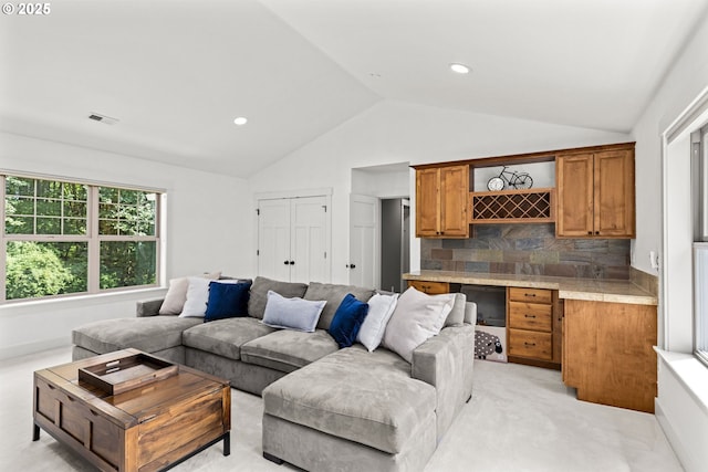 3946 SW Coronado St, Portland, OR 97219 - living room featuring vaulted ceiling and light carpet