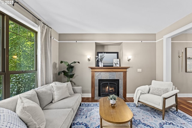3946 SW Coronado St, Portland, OR 97219 - living room featuring wood finished floors and a high end fireplace