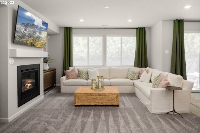 2484 SE Teal Ave, Gresham, OR 97080 - carpeted living room featuring recessed lighting and a glass covered fireplace