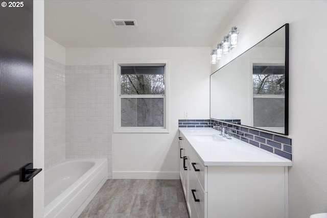 bathroom with vanity, decorative backsplash, and wood-type flooring