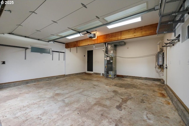 garage with heating unit, water heater, and a garage door opener