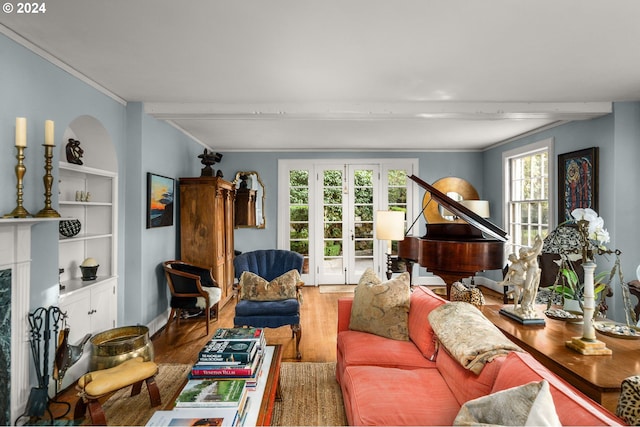 living room featuring wood finished floors and crown molding