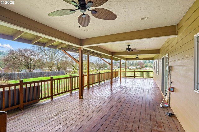 entrance to property with a patio and ceiling fan