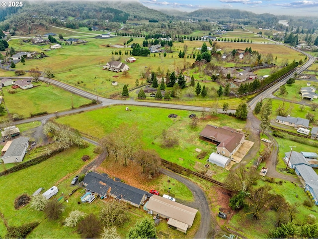 birds eye view of property featuring a rural view