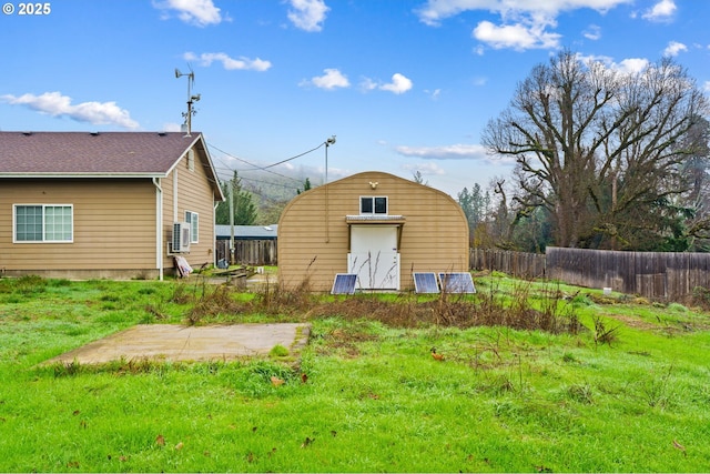 view of outdoor structure featuring a lawn