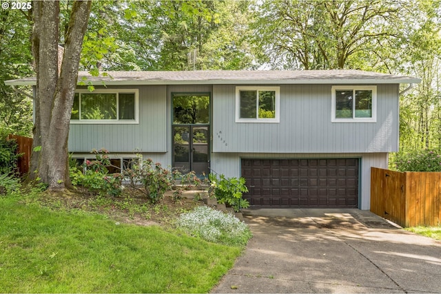 19230 Redwing Ct, Lake Oswego, OR 97035 - split foyer home with an attached garage, concrete driveway, and a shingled roof