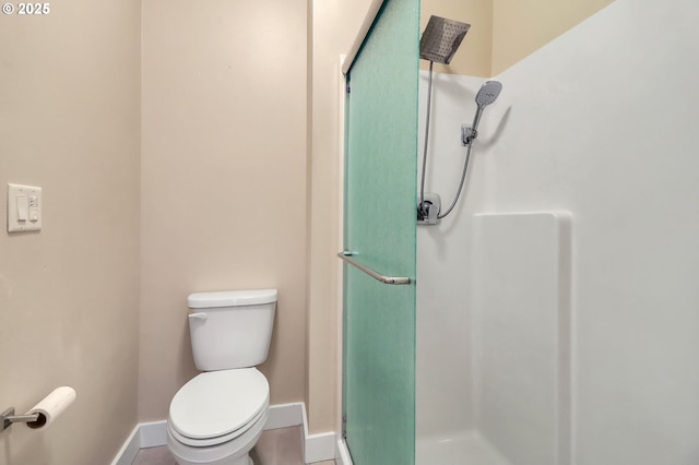 bathroom with toilet and walk in shower