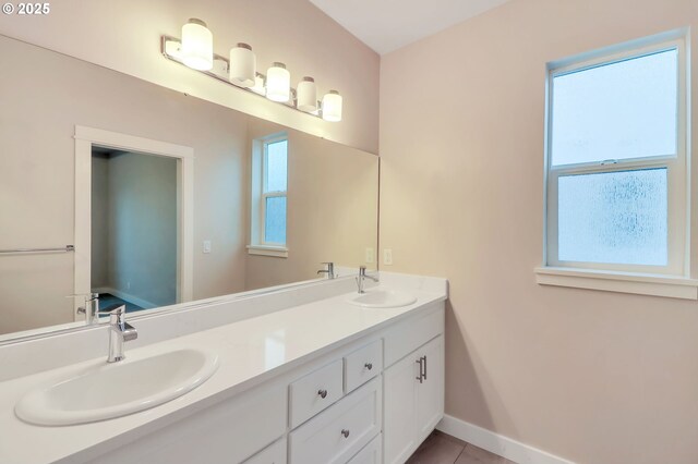 bathroom featuring vanity, tile patterned flooring, and plenty of natural light