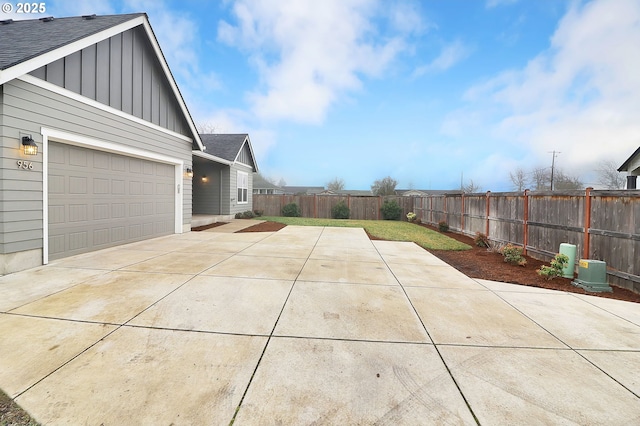 view of side of property with a garage