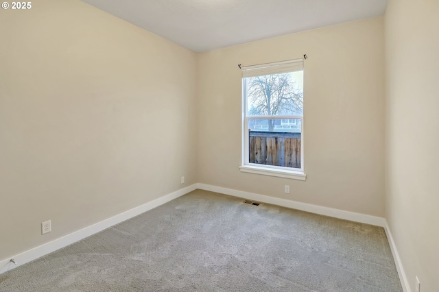 empty room with carpet flooring