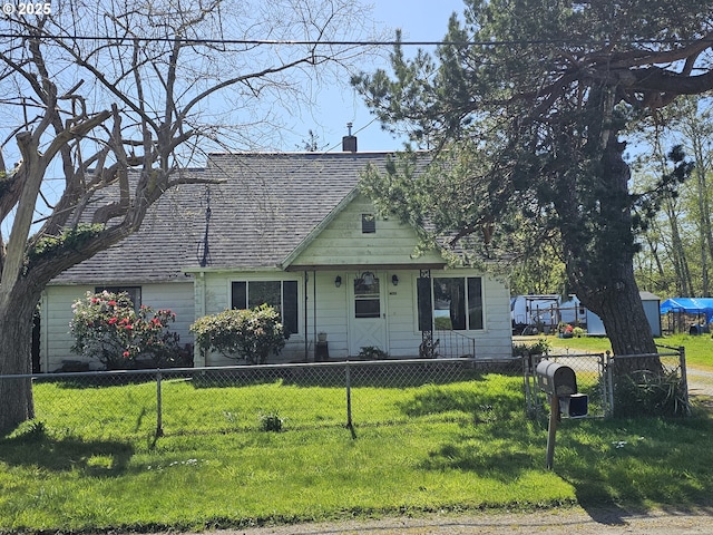472 7th Ave, Hammond, OR 97121 - view of front of property featuring a front lawn, a fenced front yard, and a chimney